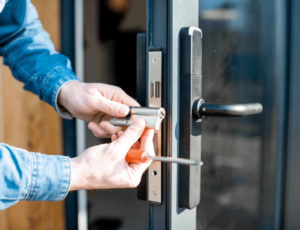 Technician at a commercial door keypad
