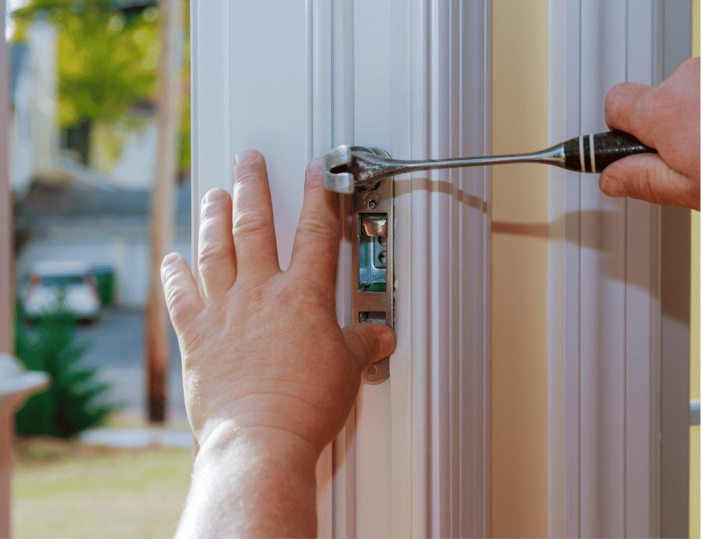 Technician at a front door deadbolt